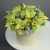 Композиция в шляпной коробке из 11 лаймовых орхидей в Серпухове